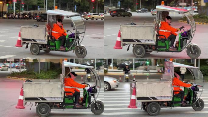 城市美容工作者环卫工人驾驶环卫车驶过路口