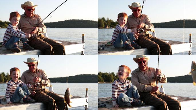 祖父和孙子在夏天日落时钓鱼