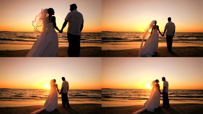 海边的新婚夫妇浪漫情侣海滨日出沙滩漫步