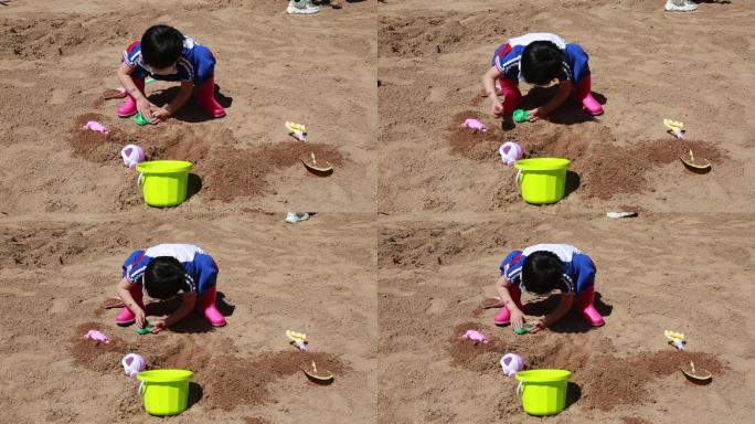 孩子户外玩沙子
