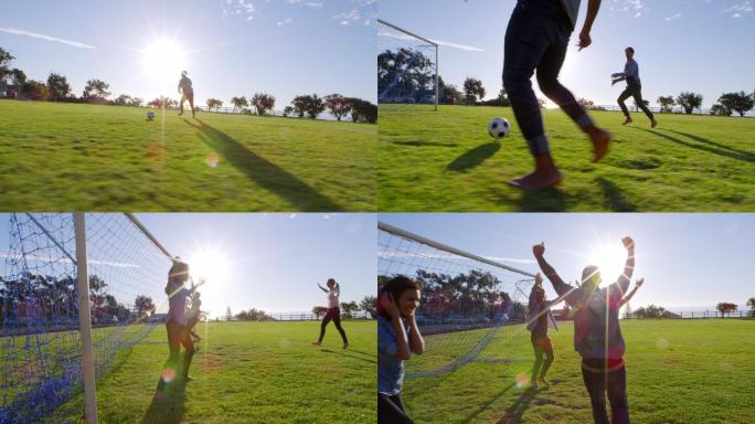 日落时分，四个年轻人在公园里踢足球
