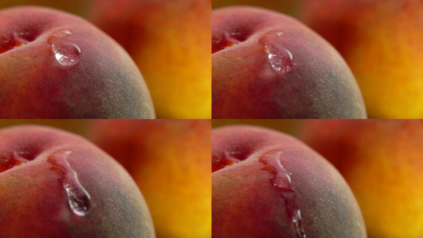 一滴水沿着桃子流下