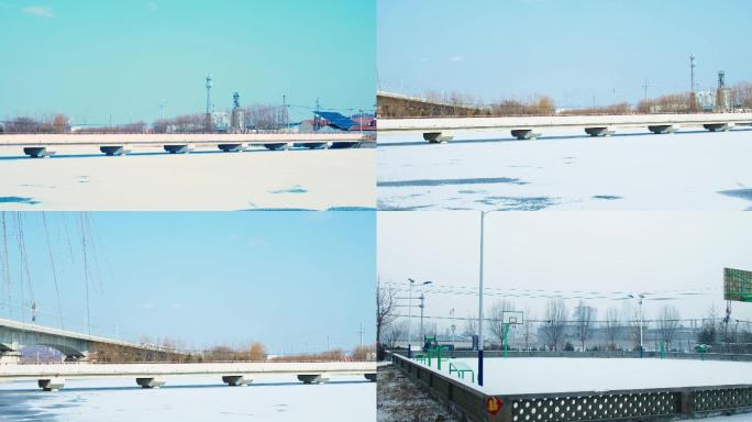 冬天农村河流结冰，积雪，篮球场