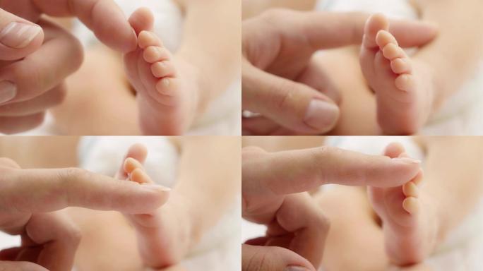 婴儿的脚在妈妈手里。