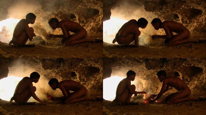 两个布须曼人在山洞里生火