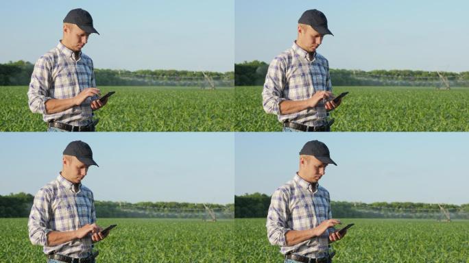 农夫在田间使用智能手机
