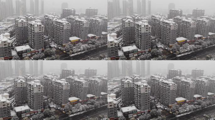 冬日鸟瞰城市雪景空镜头下雪视频