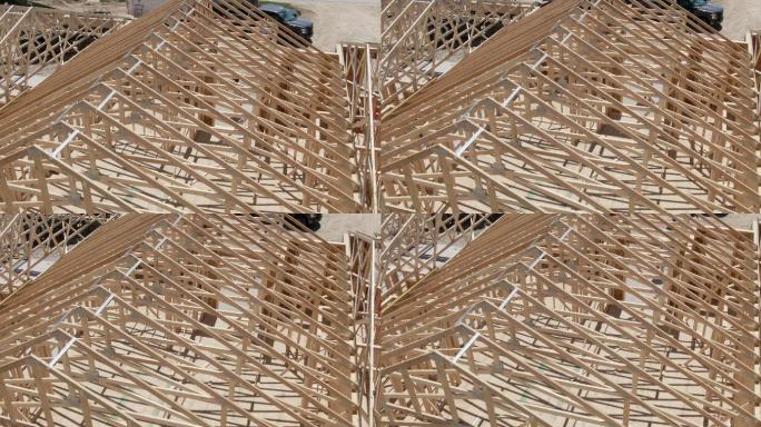 建筑工地上一排带框架房屋的木质屋架