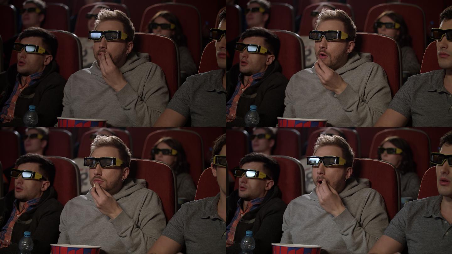 电影院里戴3d眼镜的人。