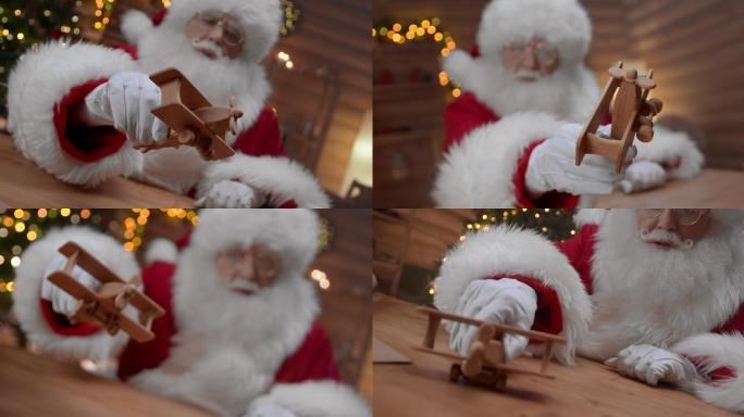 圣诞老人正拿着一架可爱的木制飞机玩