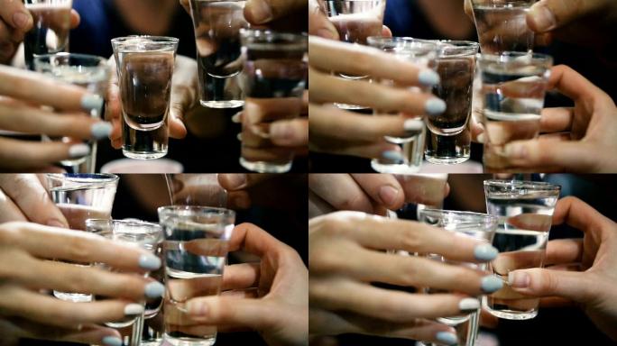 人们喝酒碰杯干杯白酒庆祝