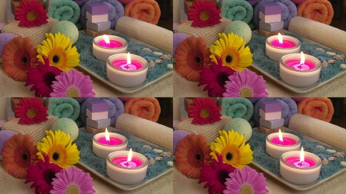 香薰蜡烛、浴盐、兰花、肥皂和毛巾