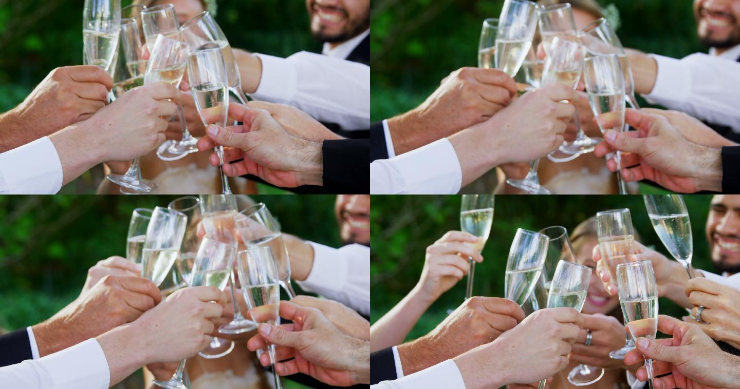 宾客与新娘新郎一起用香槟祝酒