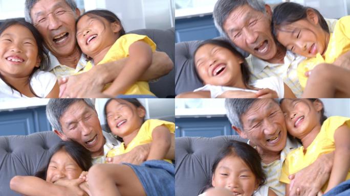 祖父和孙女大笑的慢镜头