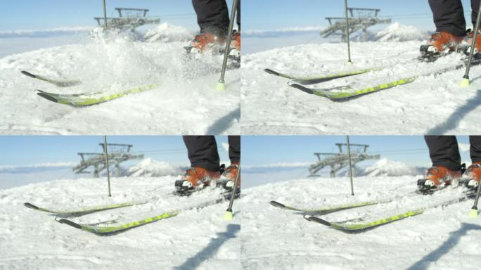 滑雪者清理滑雪板上的新鲜雪