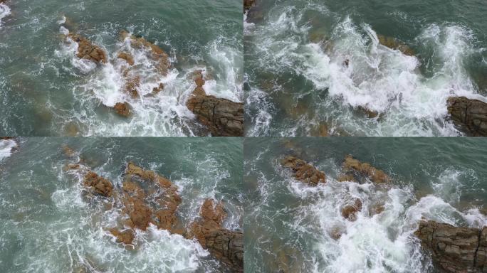 4K航拍 波涛汹涌的海浪不断拍打海岸礁石