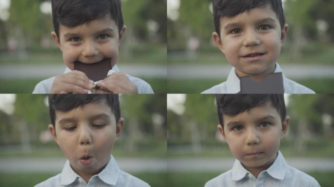 小男孩嚼着甜美可口的巧克力的特写照片