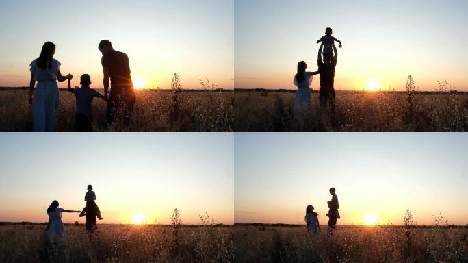 爸爸妈妈和儿子穿过麦田，观看日落