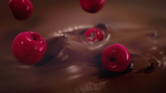 樱桃溅入液态牛奶巧克力中