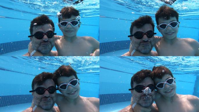 父子俩在水下潜泳