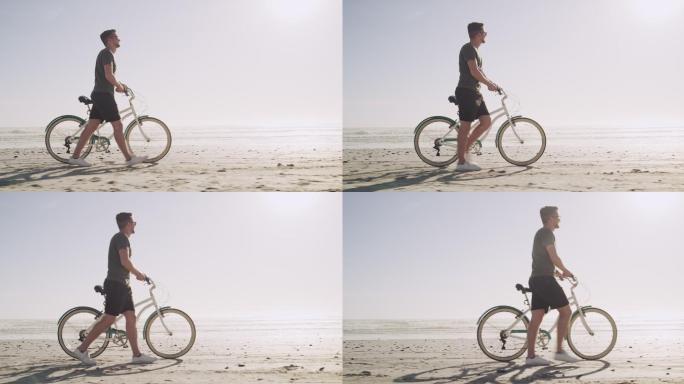 推着自行车的男子海边沙滩退潮