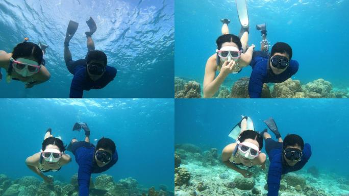 自由潜水员夫妇在海底潜水