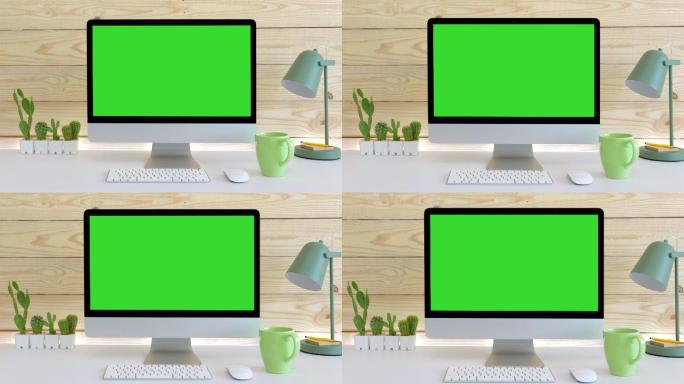 带有绿色屏幕的台式电脑。