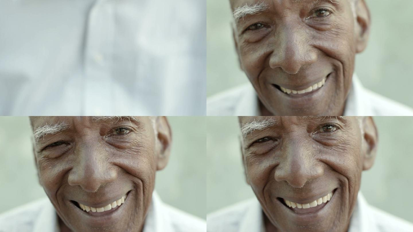 快乐的老人对着镜头微笑的特写镜头