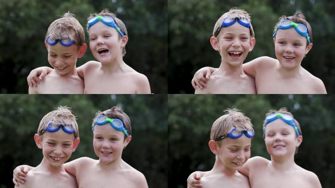 两个湿漉漉的小男孩头戴泳镜