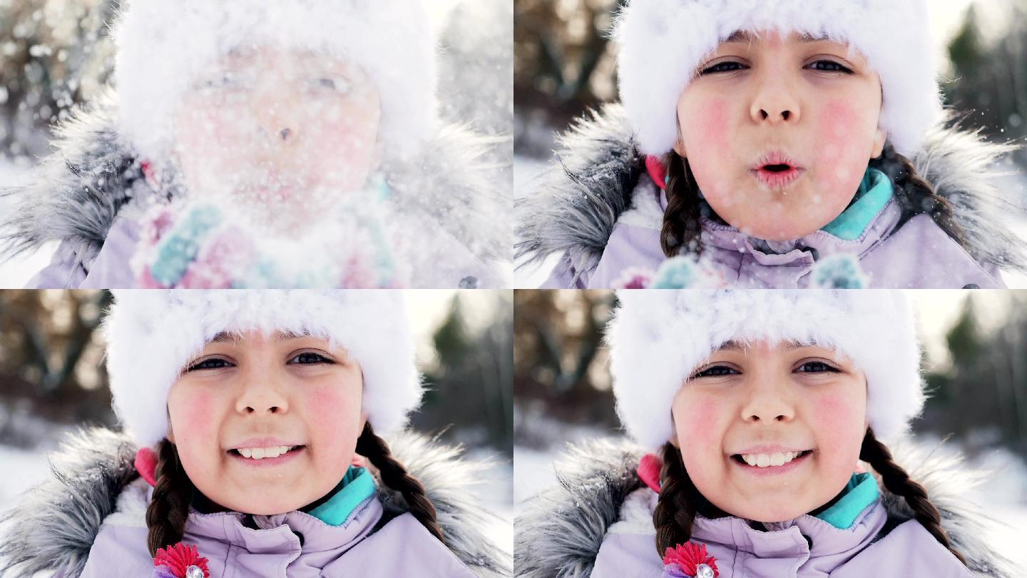 微笑着吹雪的小女孩