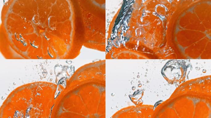 橘子片掉入水中奶茶饮料气泡水泡微距特写