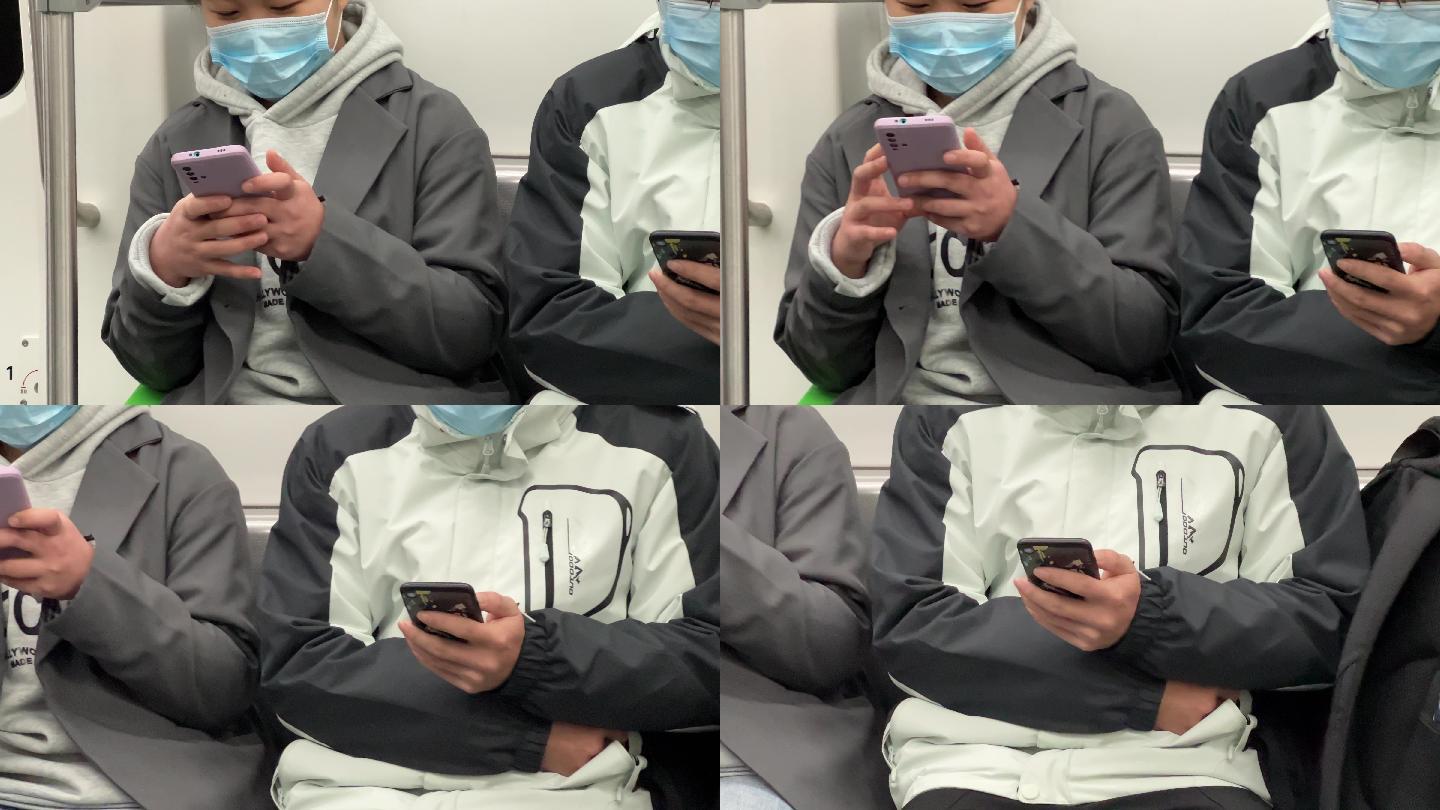 新冠疫情低头族戴口罩坐地铁沉醉式玩手机