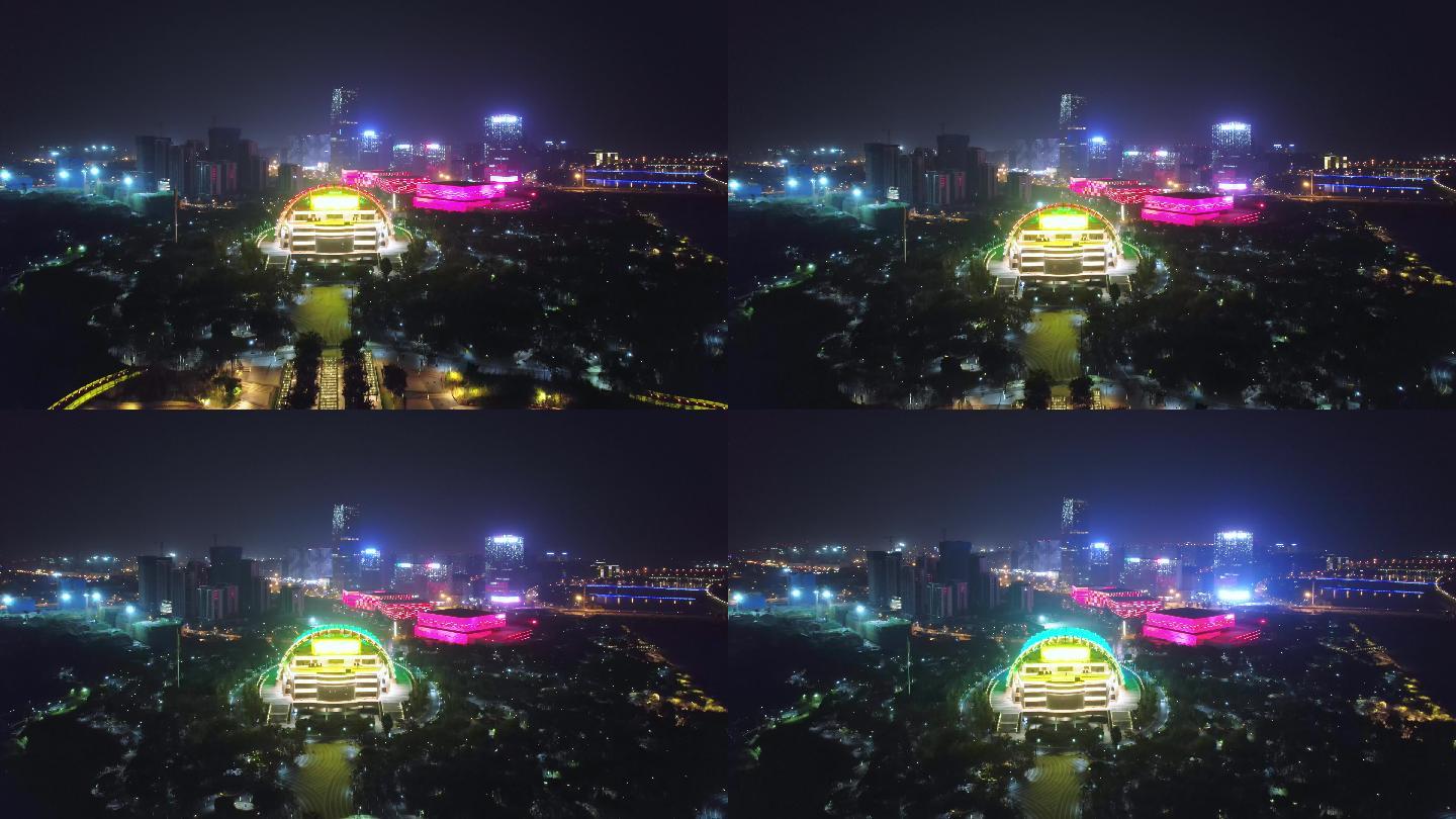 航拍夜晚金华金东新城城区中国婺剧院夜景