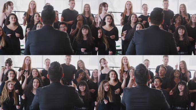 在表演艺术学校，男女学生与老师一起歌唱