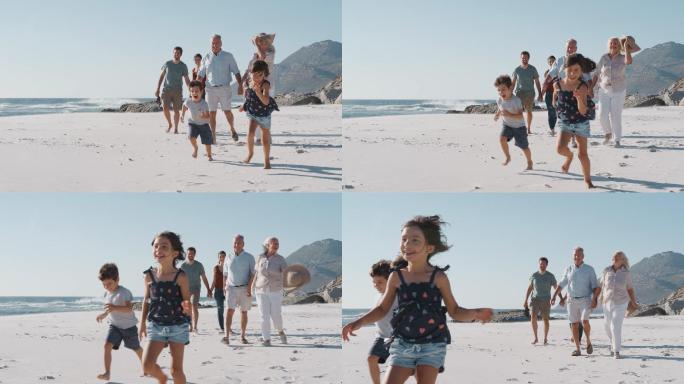 家庭成员在暑假沿着沙滩散步
