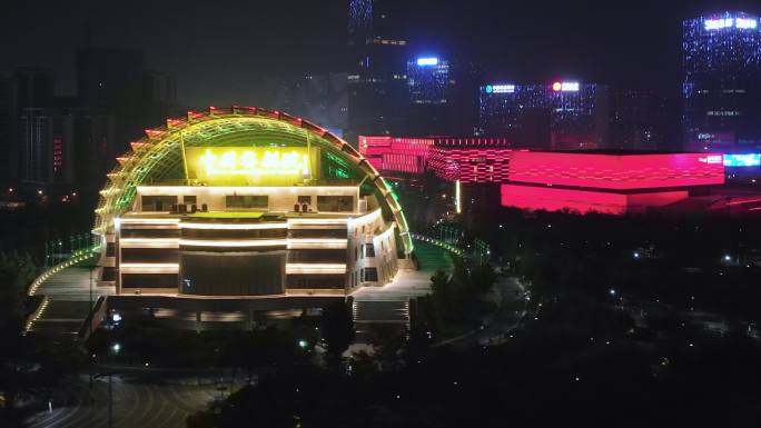 航拍夜晚金华金东新城城区中国婺剧院夜景