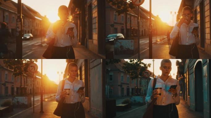 年轻女子日落时在城市里散步，带走咖啡