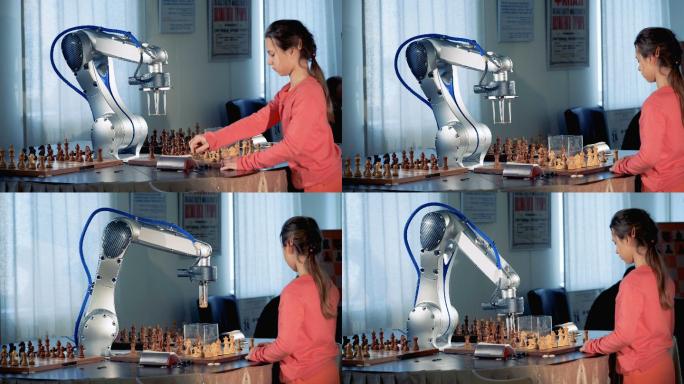 女孩和现代象棋机器人下棋