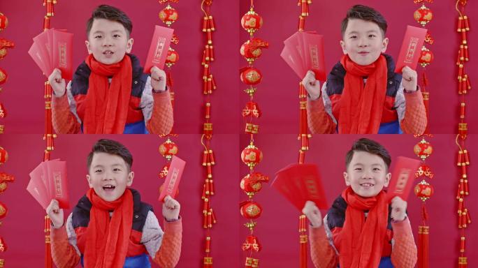春节期间亚洲男孩手拿红包拜年4K高清视频