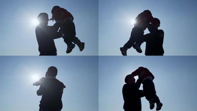 父亲节父亲抱起孩子逆光温馨视频举起小孩子