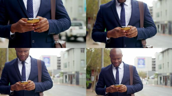男子站在街头玩手机