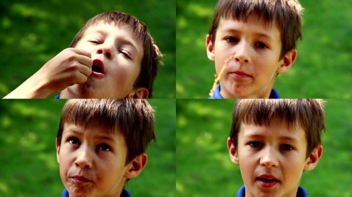 男孩吃着葡萄看着镜头