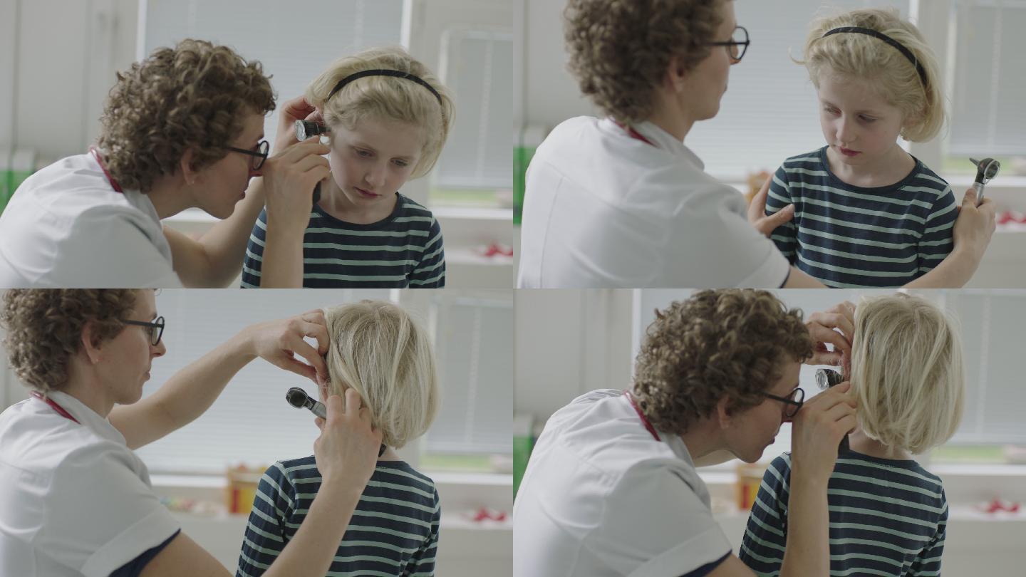 医生用耳镜检查男孩的耳朵