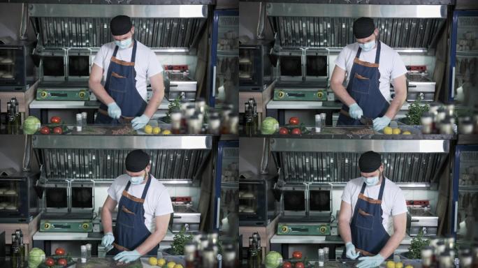 男厨师戴着口罩在餐厅工作