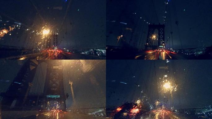 在夜雨中在曼哈顿大桥上开车。
