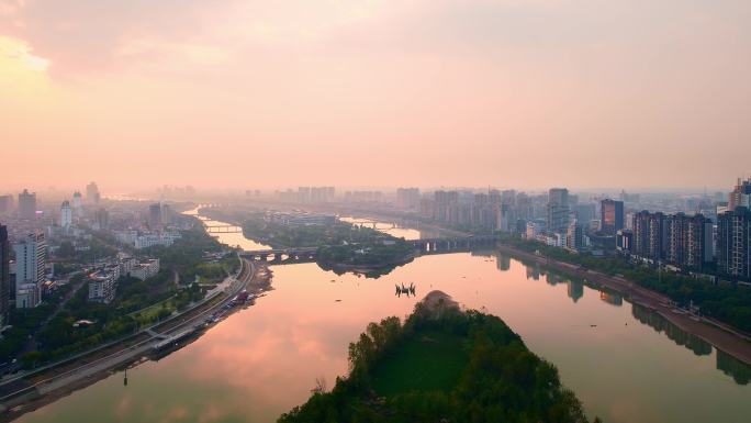 航拍夕阳金华城区江五百滩公园现代城市风光