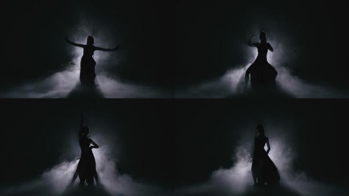 剪影舞女在雾中表演