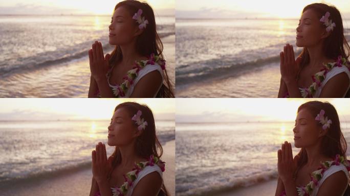 一位女子在海边祈祷