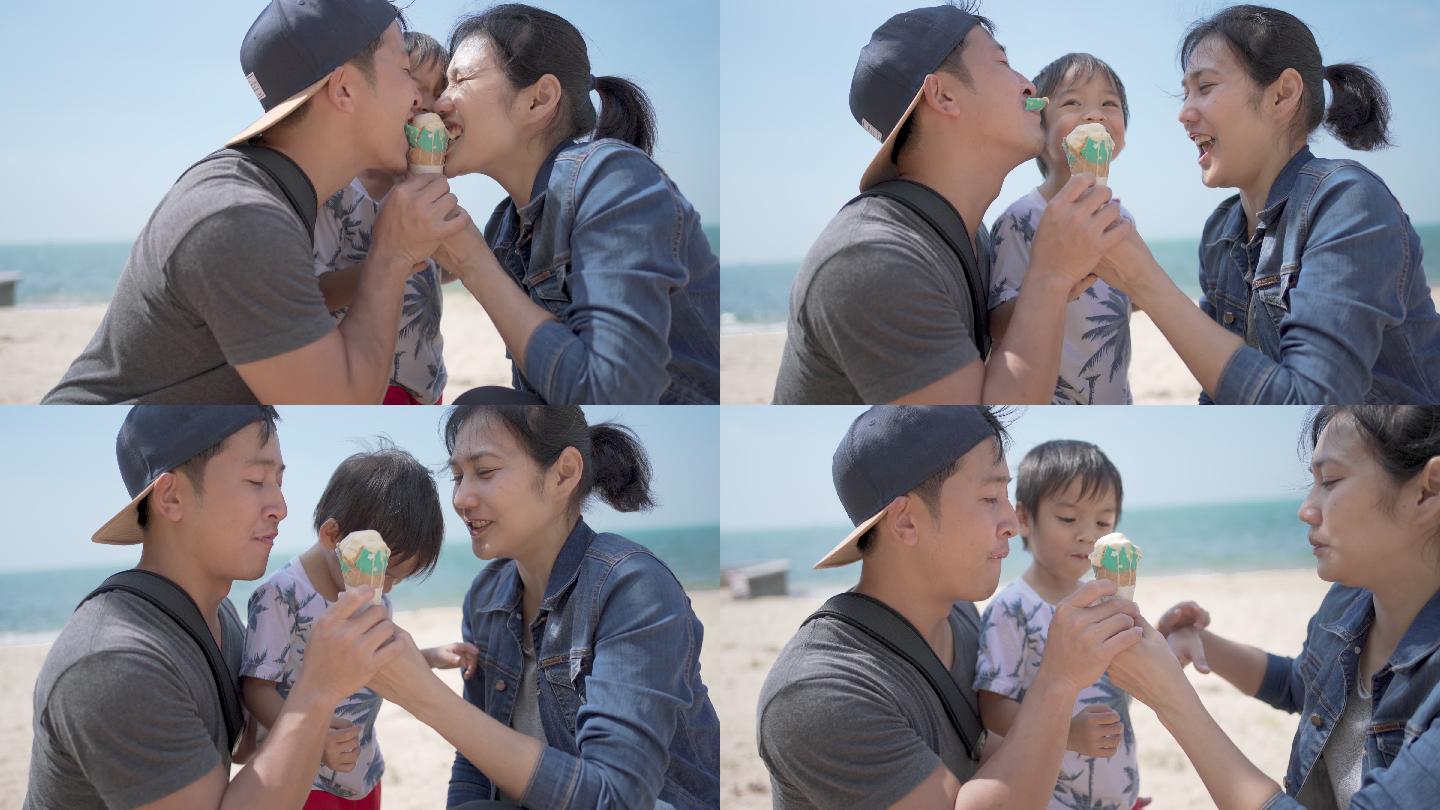 快乐的家庭在度假日一起在海滩吃冰淇淋蛋筒