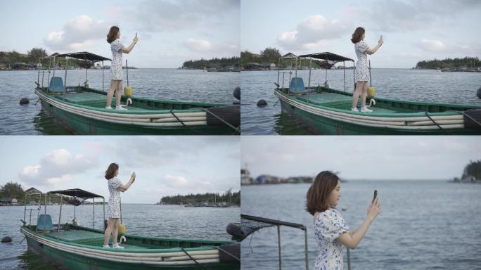 女孩小渔船上看海微笑海边情绪短片旅拍